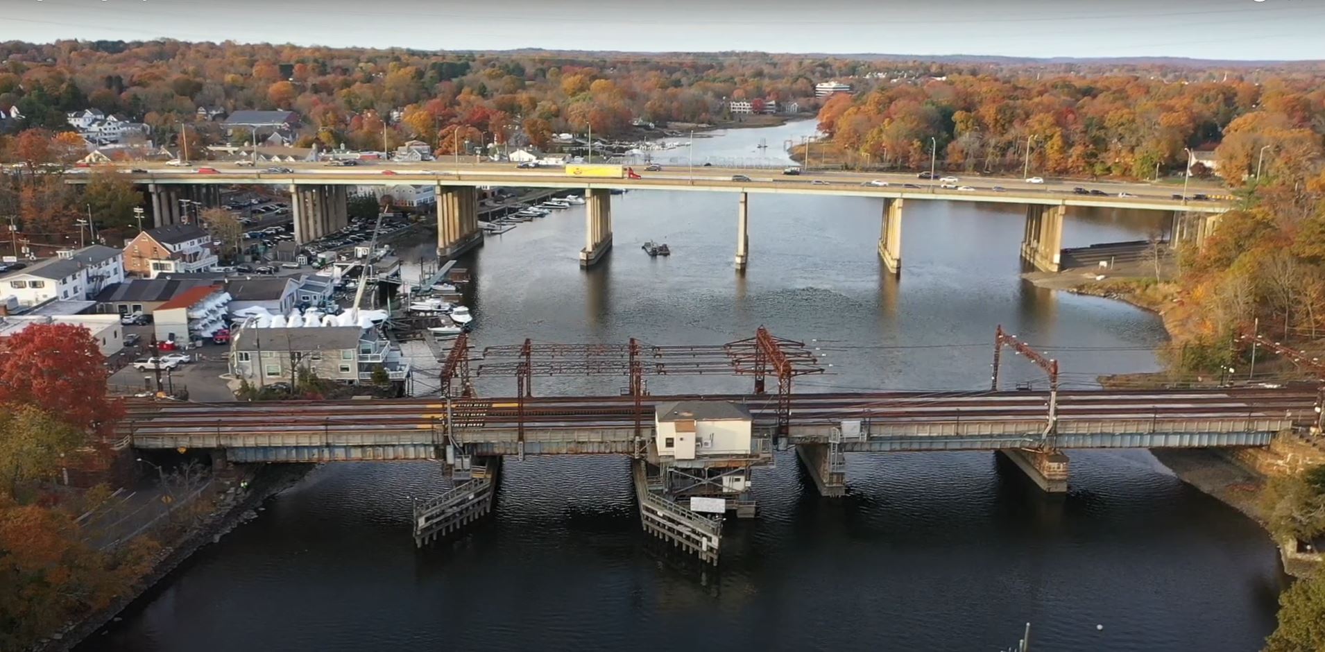 Aerial photo of the Saugatuck River Railroad Bridge looking north over Saugatuck River with I-95 highway bridge in background.